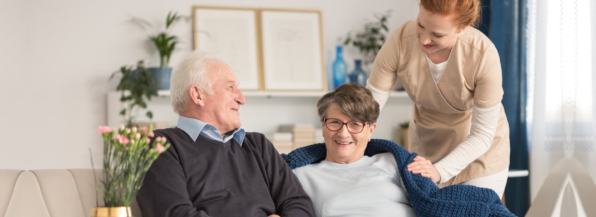 senior couple assisted by nurse