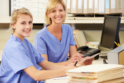 two female caregivers smiling