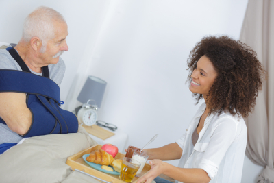 caregiver brought food to senior man